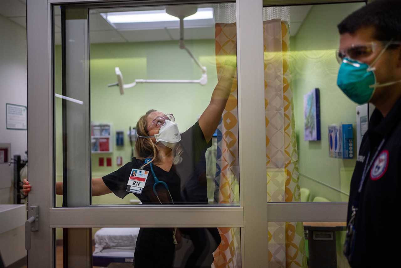 Jillian Nickerson tries to fix a stuck door in a newly opened room in the emergency department at Children&acirc;s Hospital New Orleans on Aug. 20, while Paul Decerbo from the Rhode Island-1 Disaster Medical Assistance Team looks on.