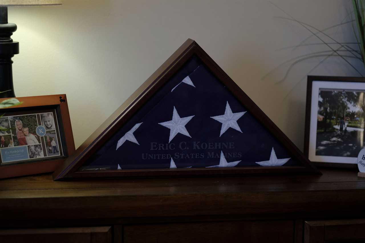 A burial flag for Eric Koehne, who passed away from COVID-19, is displayed in the living room of the Koehne family. Lyndhurst, New Jersey, 2021 &Acirc;&copy; Sean Sirota for Time Magazine