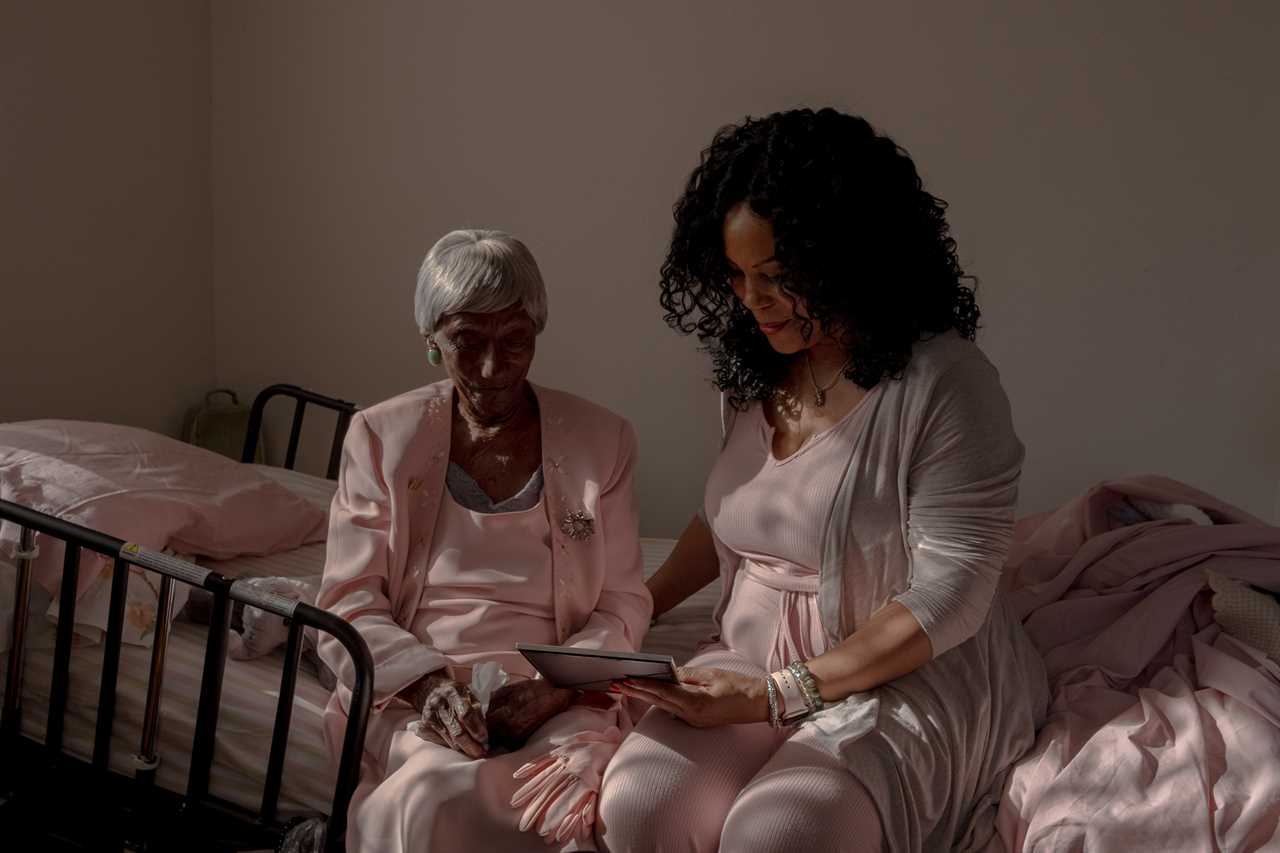 Stackhouse and Thornhill look through Stackhouseâs photographs.