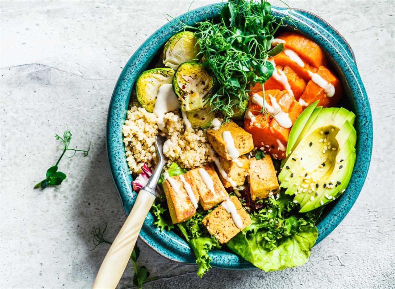tofu bowl with veggies, avocado, and quinoa