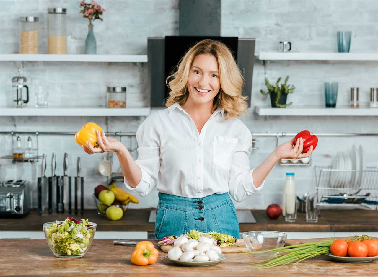 woman cooking with bell peppers to live a longer life