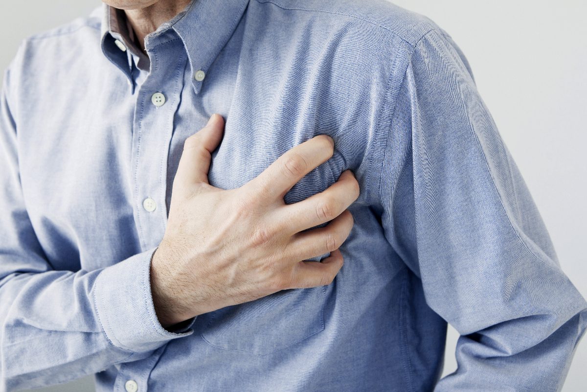 older man experiencing chest pain, heart attack