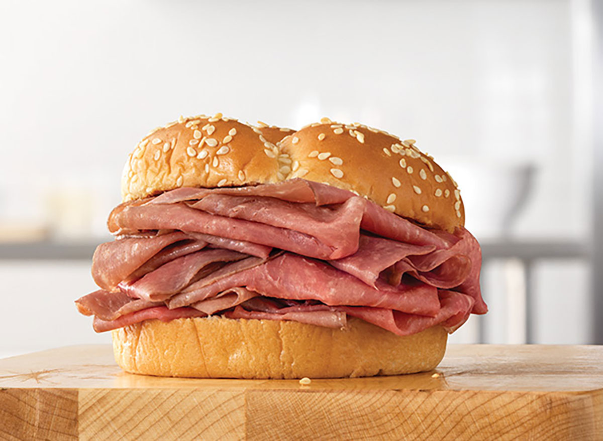 arby's classic roast beef sandwich on wood block