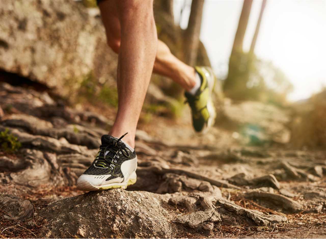 close-up runner or jogger on uneven trail