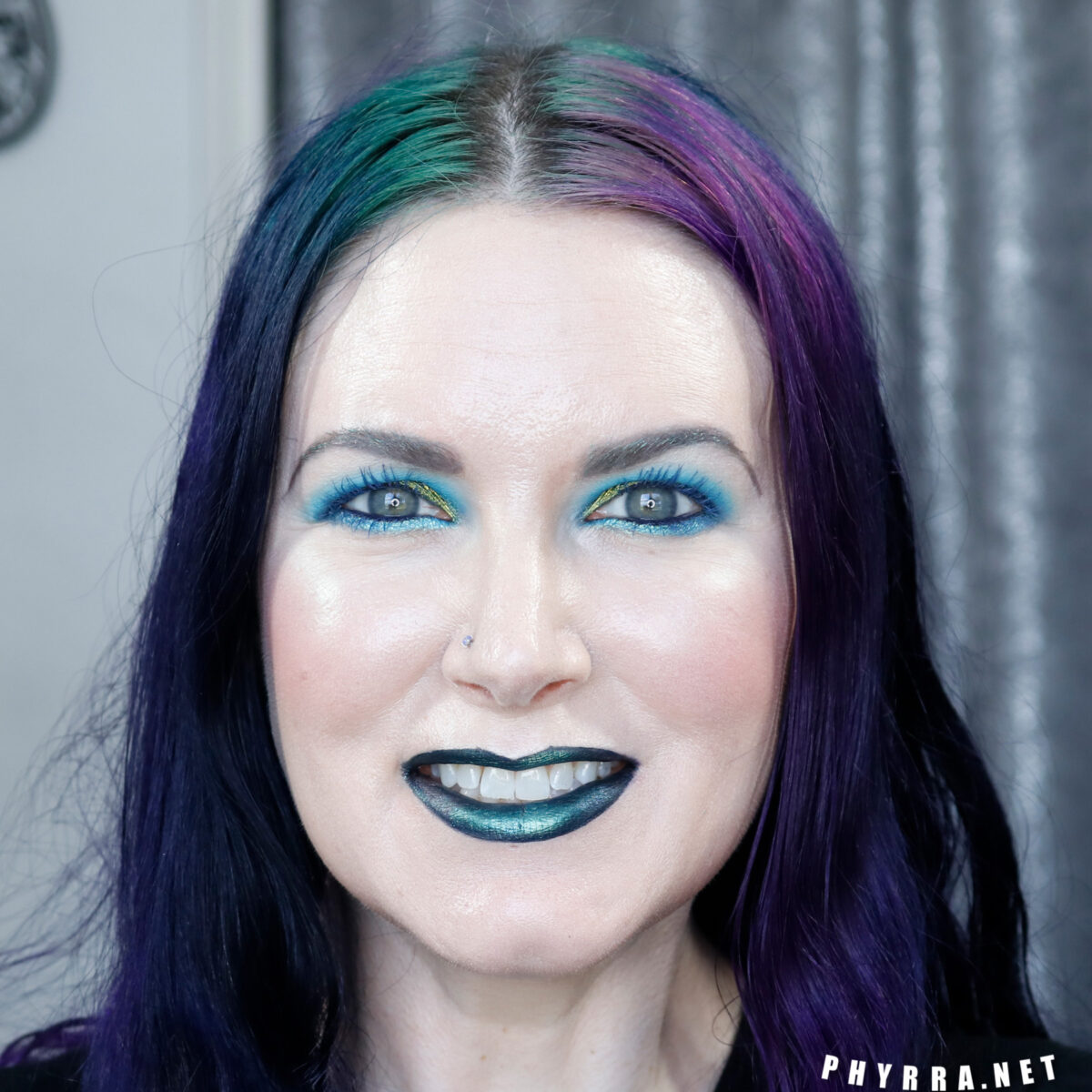 Cordelia is wearing Multichrome makeup on hooded eyes