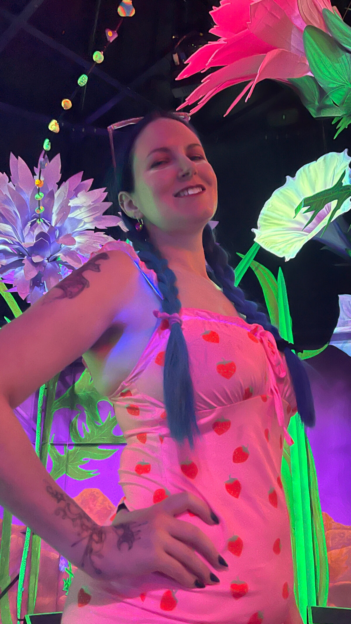 Cordelia is at the Meow Wolf experience in Las Vegas in blacklight