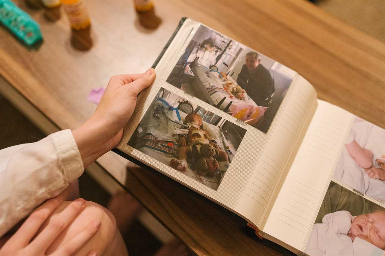 Knight looks through her scrapbook. She had three open-heart surgeries as a baby and still has to carefully monitor the strain placed on her heart. 