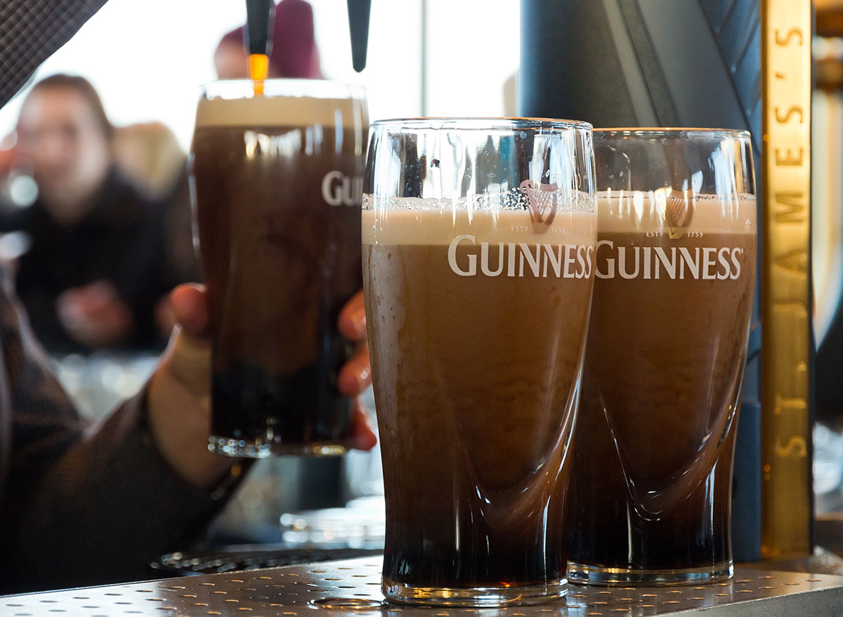 3 guinness glasses being poured