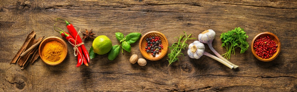 Various herbs and spices on wooden table