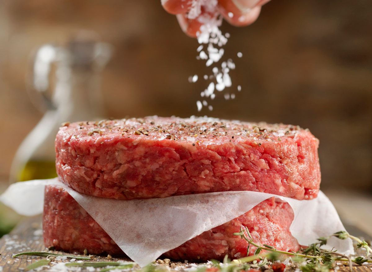 season burger patty with salt and pepper