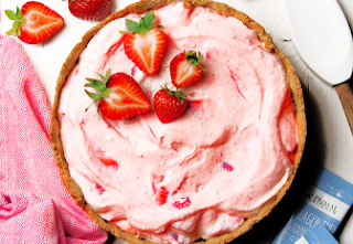 Strawberry pie topped with fresh strawberry halves.