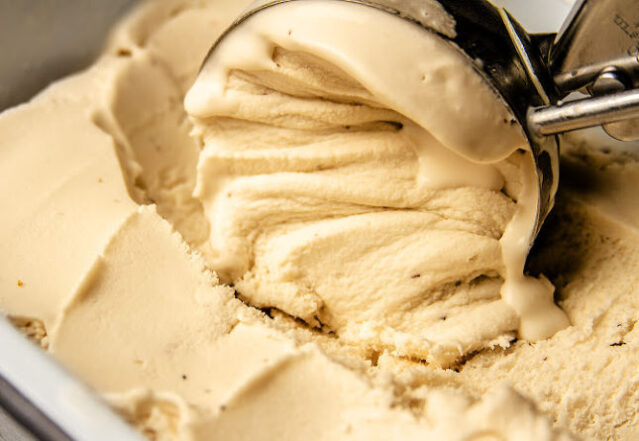 Close-up shot of scooping caramel ice cream.