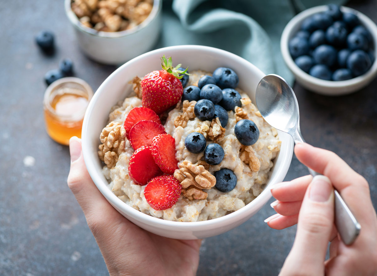 bowl of oatmeal with strawberries and <a href=