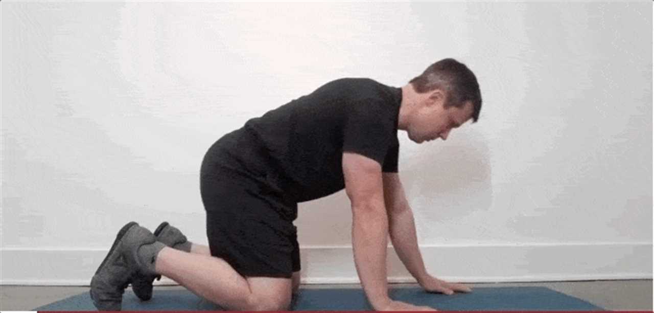 Coach Jim holding the top of a push-up