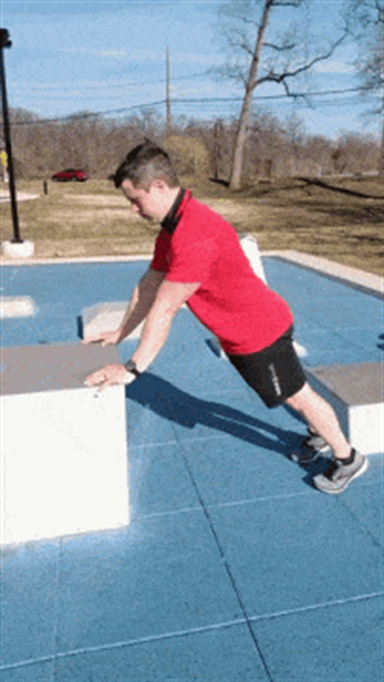 Coach Jim doing elevated push-up