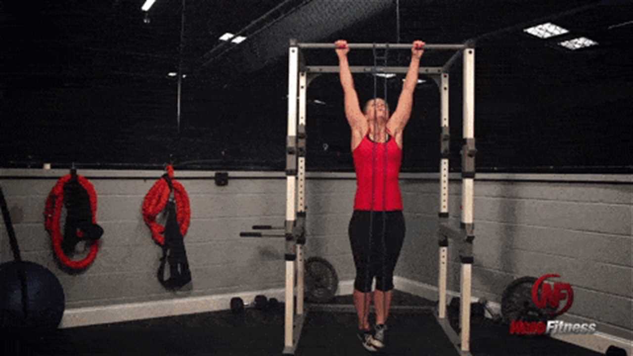 Staci using a band for an assisted pull-up, a great <a href=