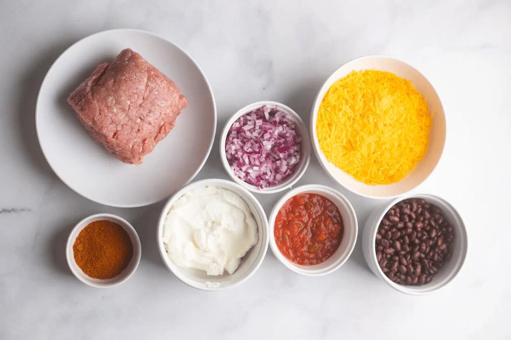 Overhead view of healthy chili cheese dip ingredients.