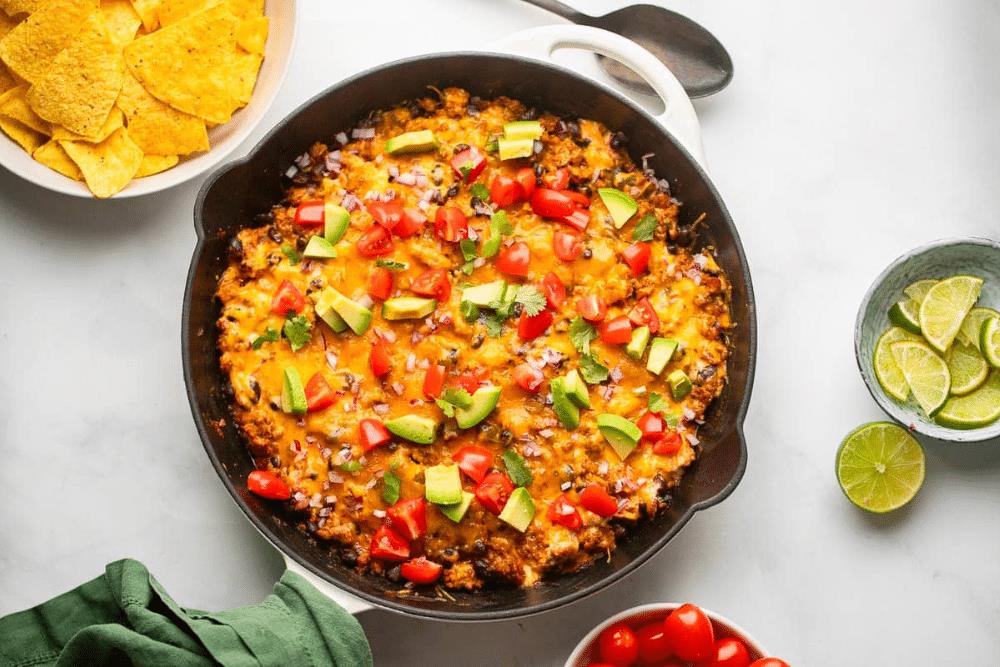 Overhead view of healthy chili cheese dip in a skillet.