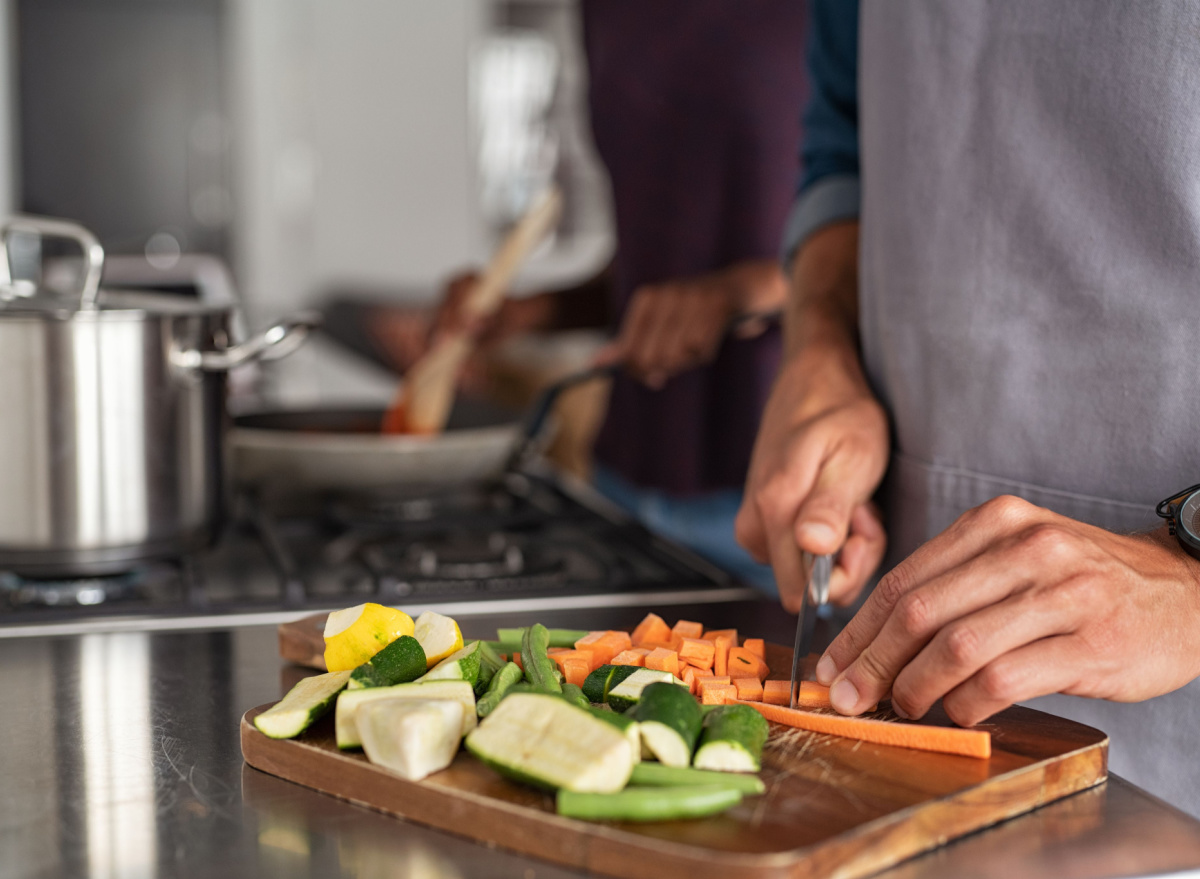 man cutting vegetables