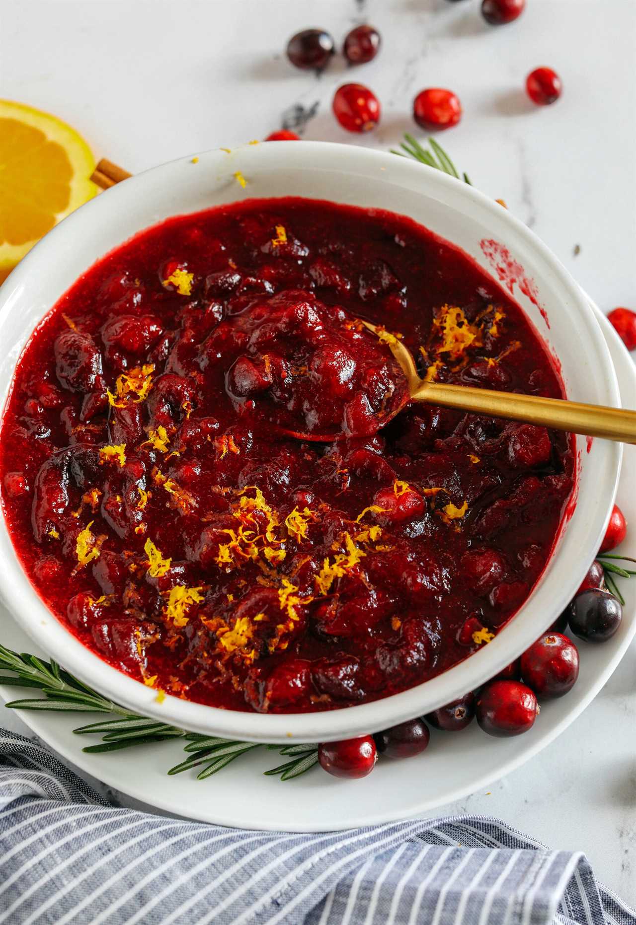 This Healthy Cranberry Sauce is naturally sweetened made with maple syrup, fresh orange juice, cinnamon, ginger and deep rich flavors from a little port wine.  Sweet, tangy and the perfect addition to your Thanksgiving and Christmas table this season!