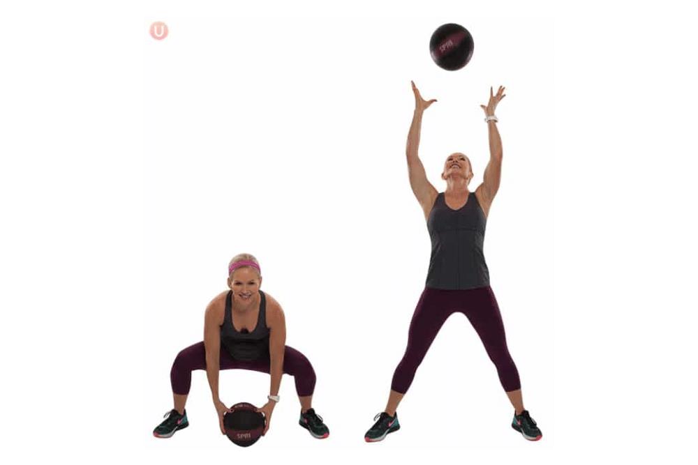 Chris Freytag demonstrating medicine ball squat thrusts.